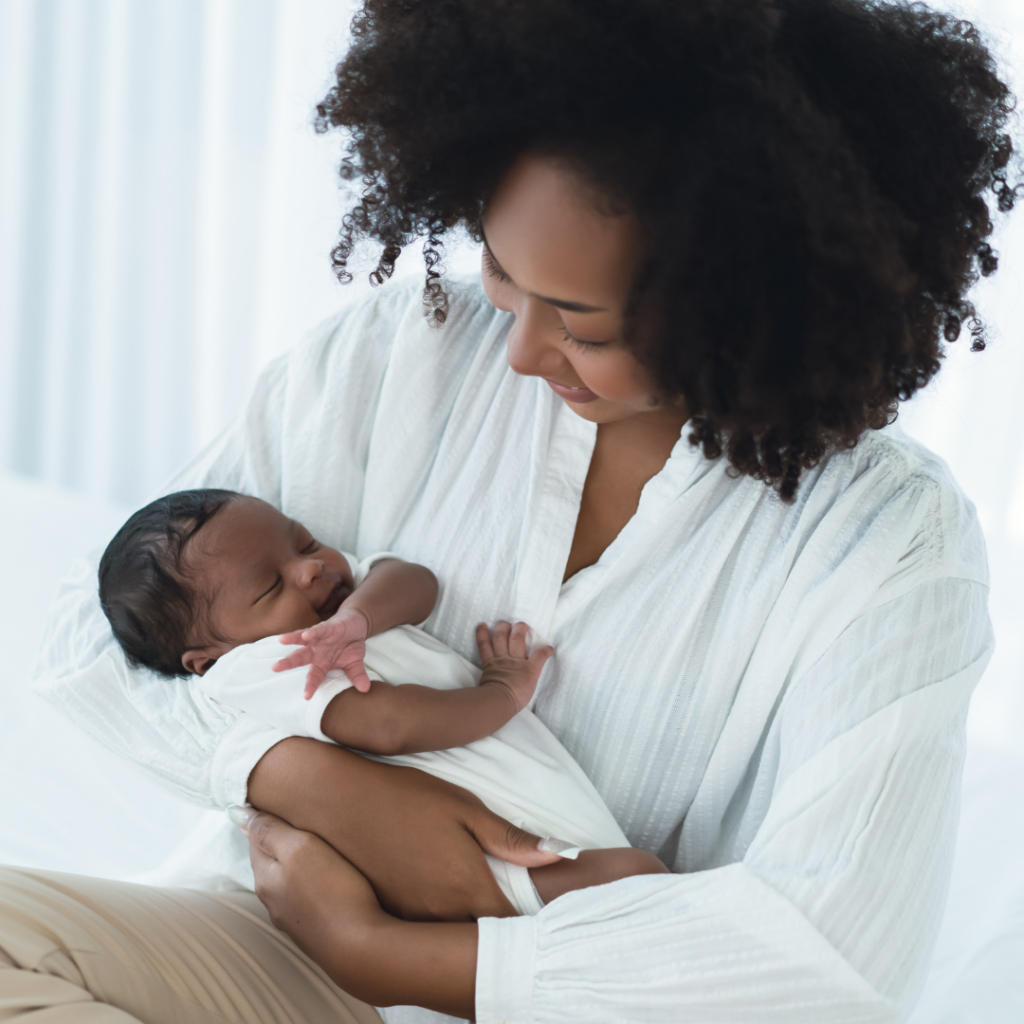 An image of a black mother on a blog about postpartum resources for moms of color. 