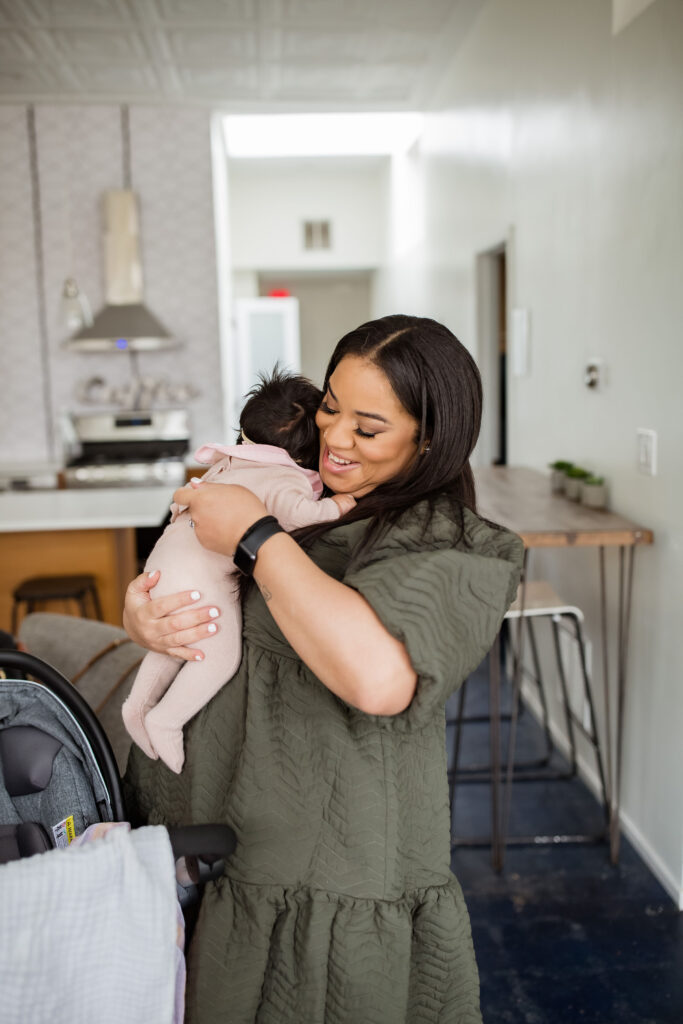 An image of a mom on a blog about postpartum resources for moms of color. 