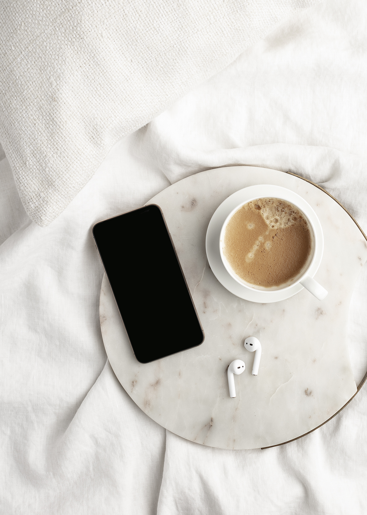 image of phone and beverage on a blog post about therapy intensives for moms in Boston