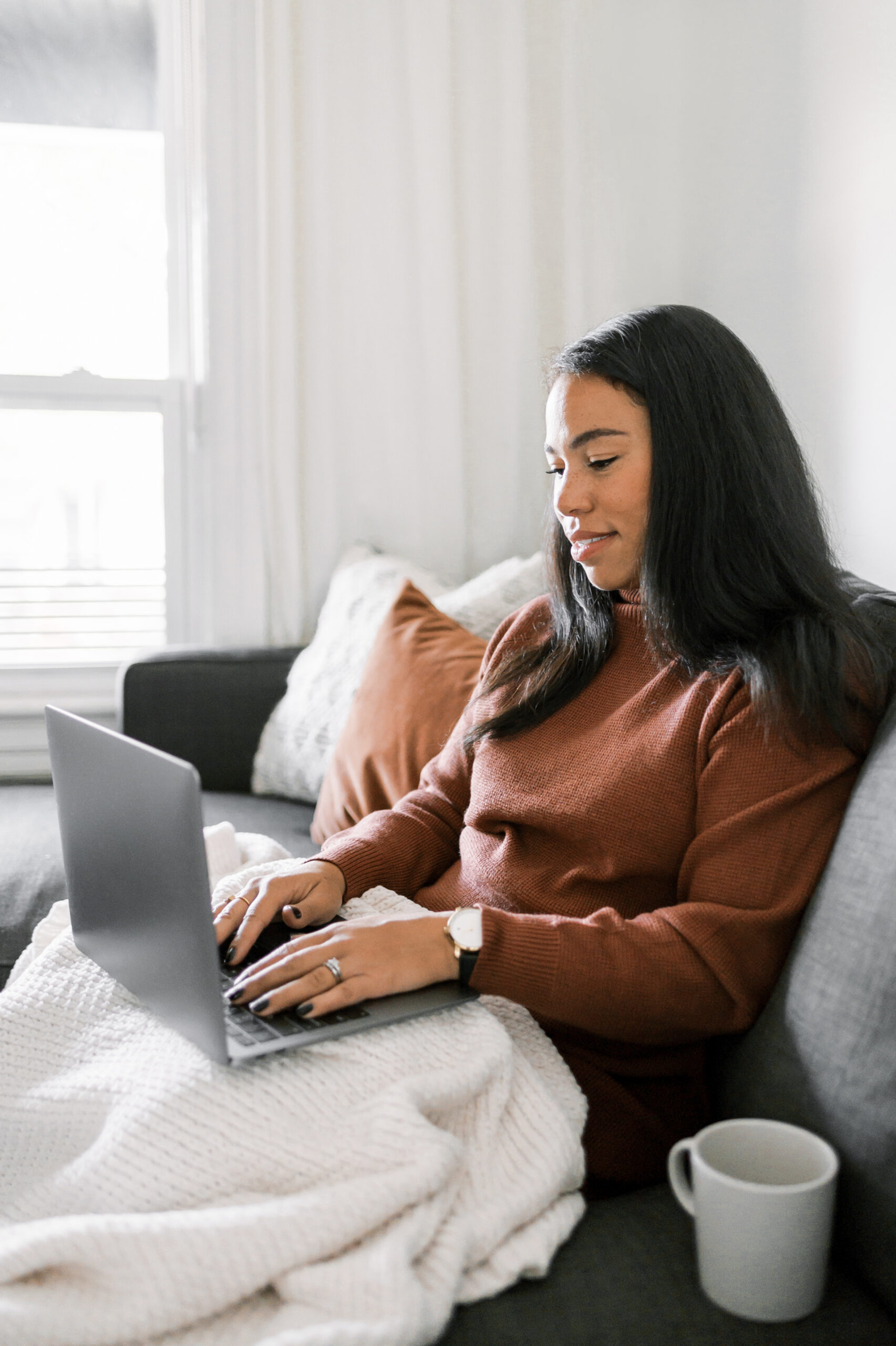 an image of a woman on her phone on a blog post about therapy intensives for busy moms