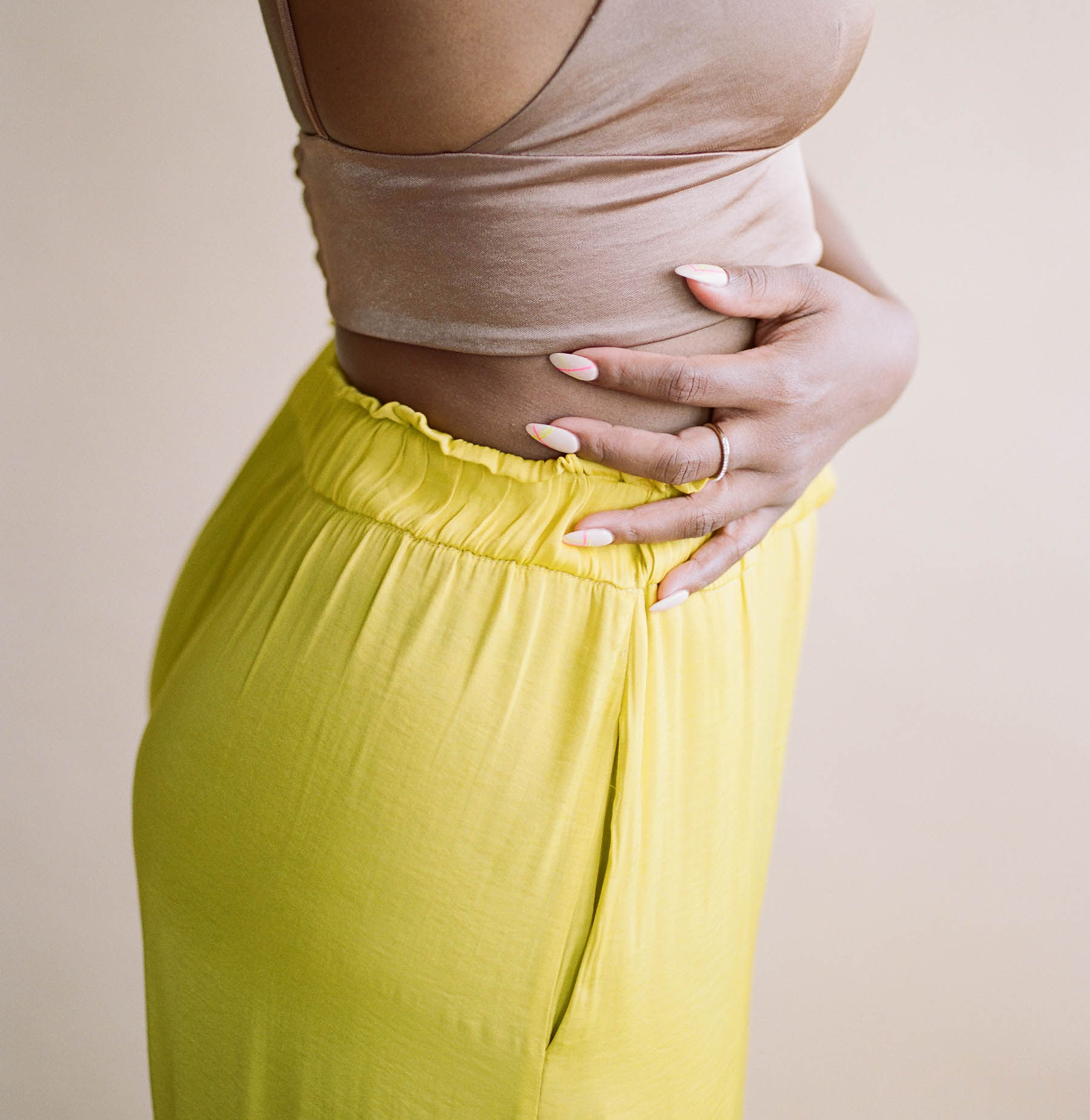 image of a woman holding her waist