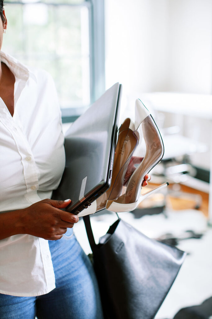 an image of a woman with her heels and planner on a blog post about self-care tips for working moms