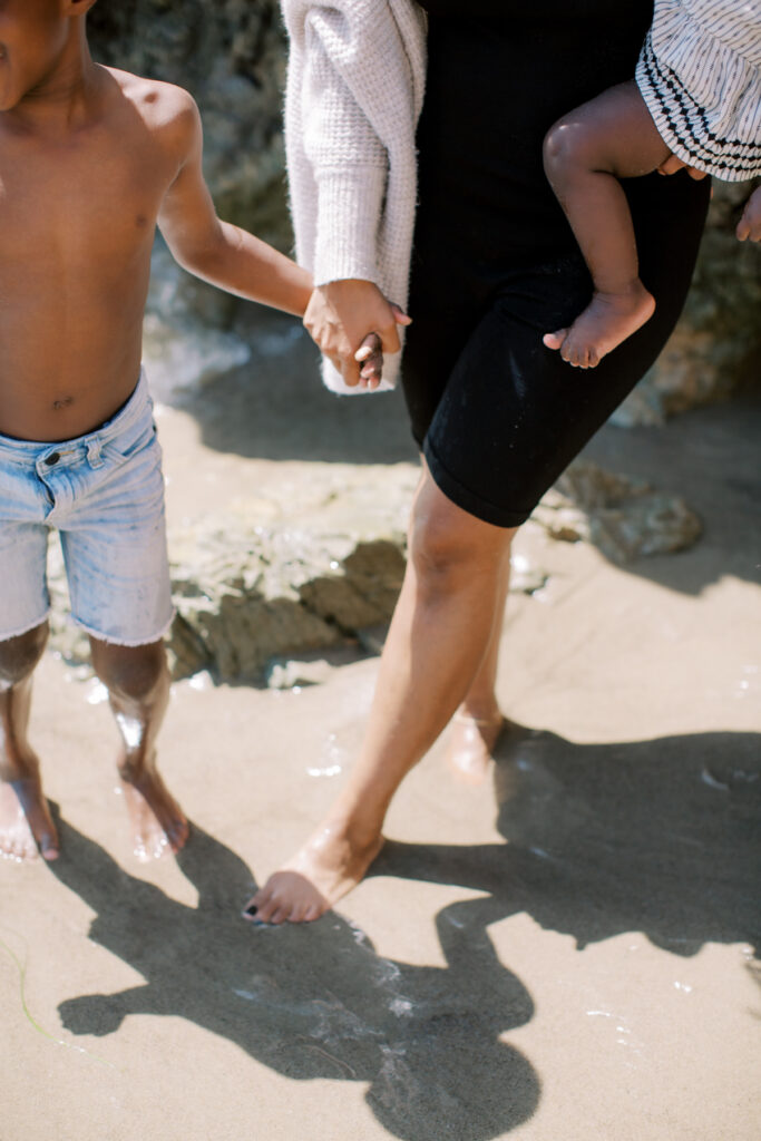 an image of a black mom and her children on a blog post about Matrescence for Moms of Color