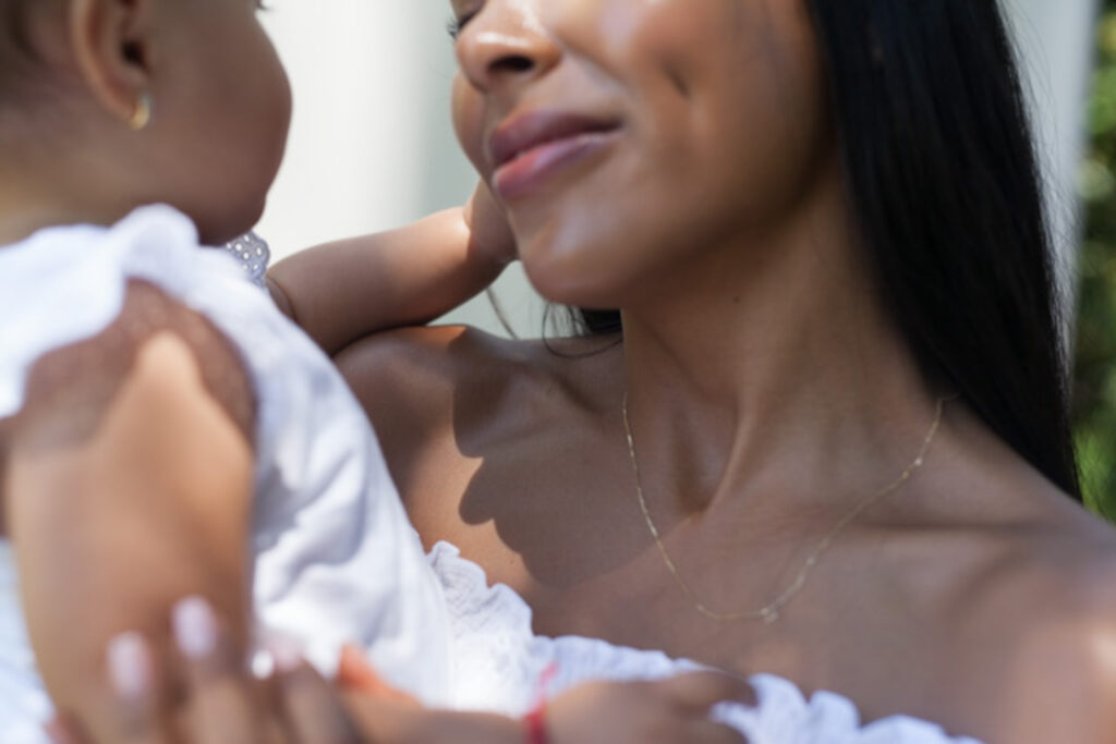 image of a black mother and child on a blog post about depletion in motherhood and matrescence for women of color